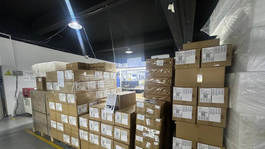 Finished GPS tracker cartons labelled and palletised
