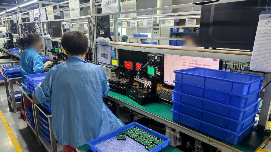 Test station at a Shenzhen partner facility, with boards being checked before packing