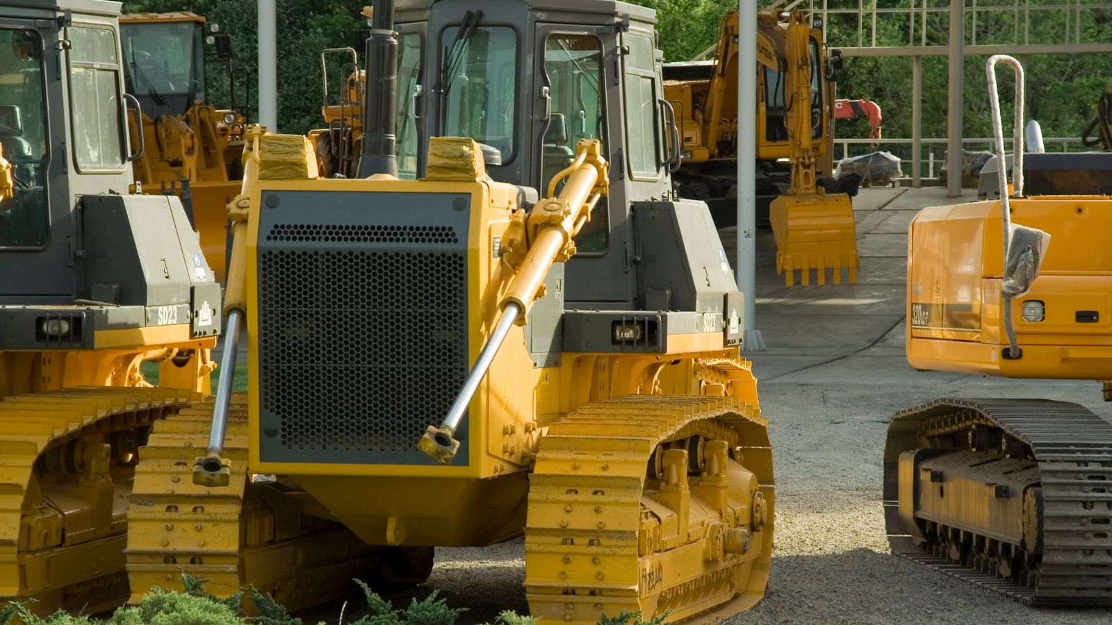 Line of construction machines ready in an equipment yard