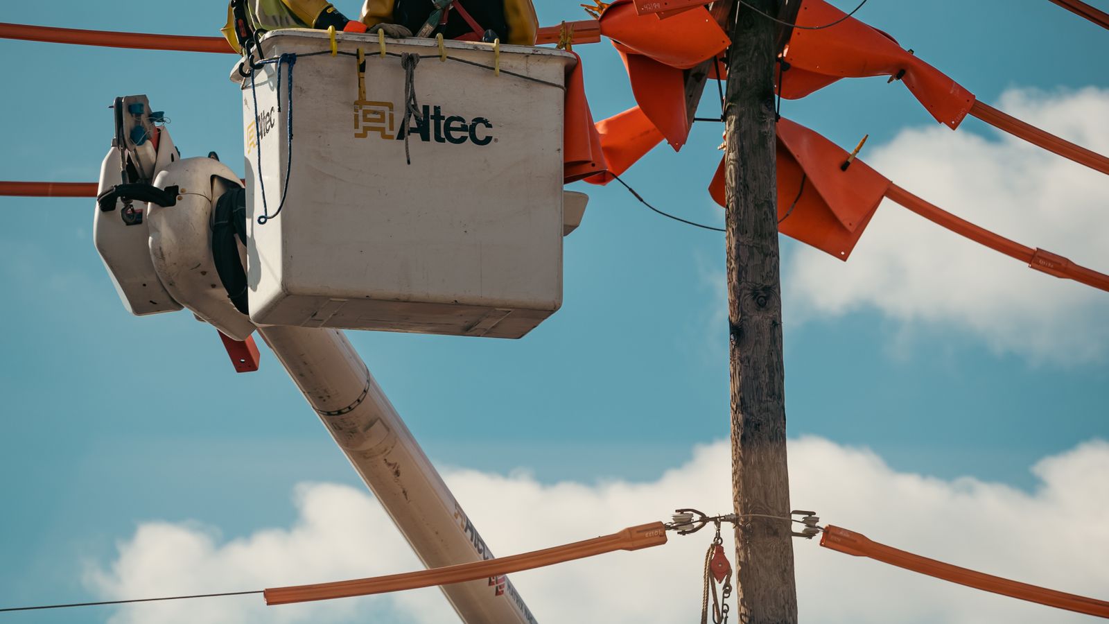 Utility field-service team working with mobile equipment